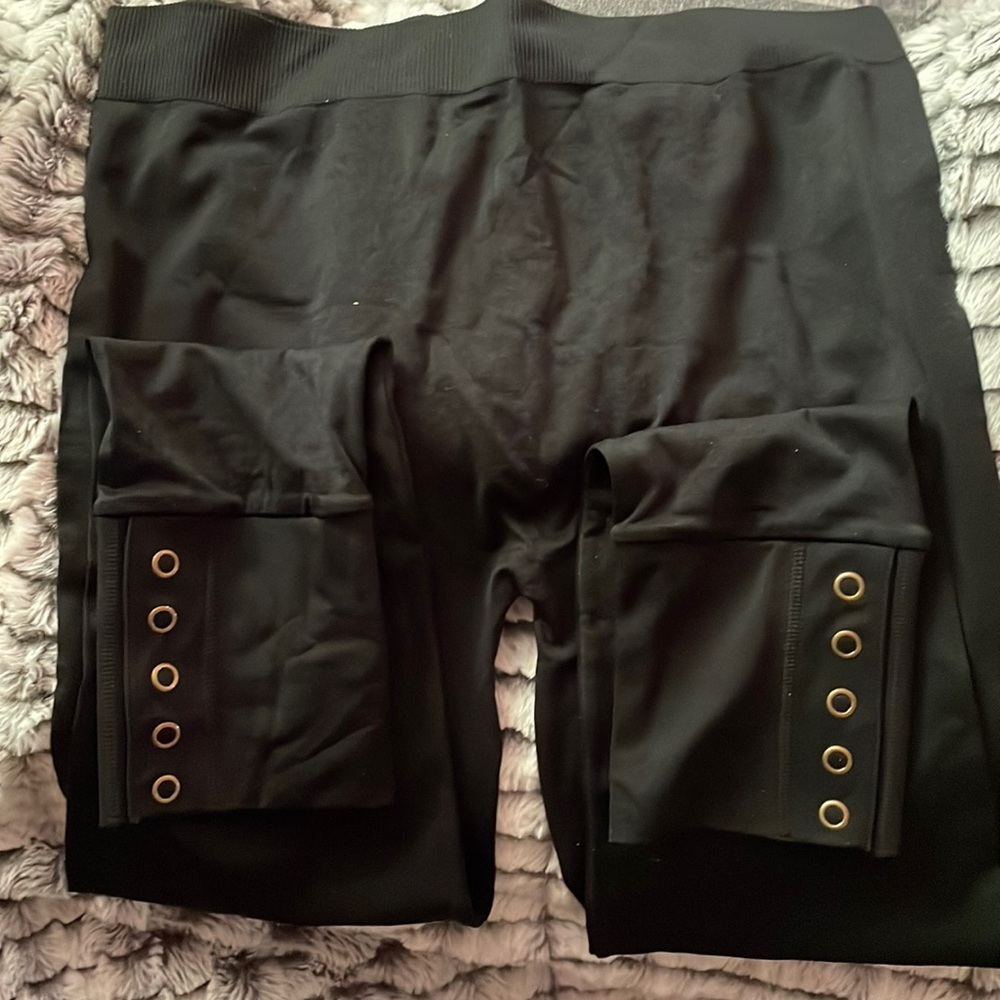 NWOT~ Black plus size woman’s leggings with snap closures at the ankle.